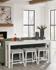 Ashley Furniture Robbinsdale counter height dining table with three matching barstools, showcasing a stylish wood finish and modern design.