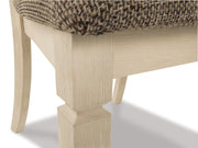 Detail of Ashley Furniture Bolanburg dining room set, showing the table and chair design with wood finish and comfortable seating.