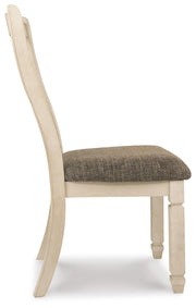 Ashley Furniture Bolanburg dining room set with a table and six upholstered chairs, showcasing a modern wooden design.