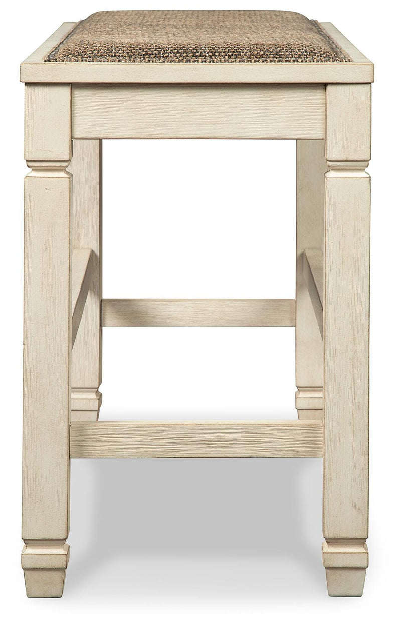 Ashley Furniture Bolanburg dining room set with a wooden table and matching chairs, shown from a side view.