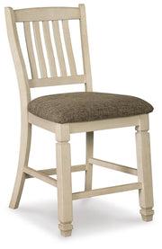 Ashley Furniture Bolanburg dining room set with a wooden table and matching chairs, shown from an angled side view.