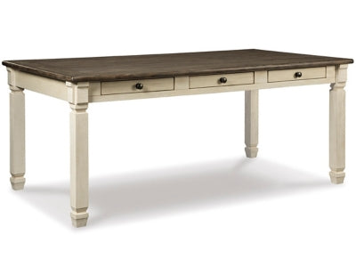 Ashley Furniture Bolanburg dining table with a wooden surface and sturdy legs, shown in a spacious dining room setting.