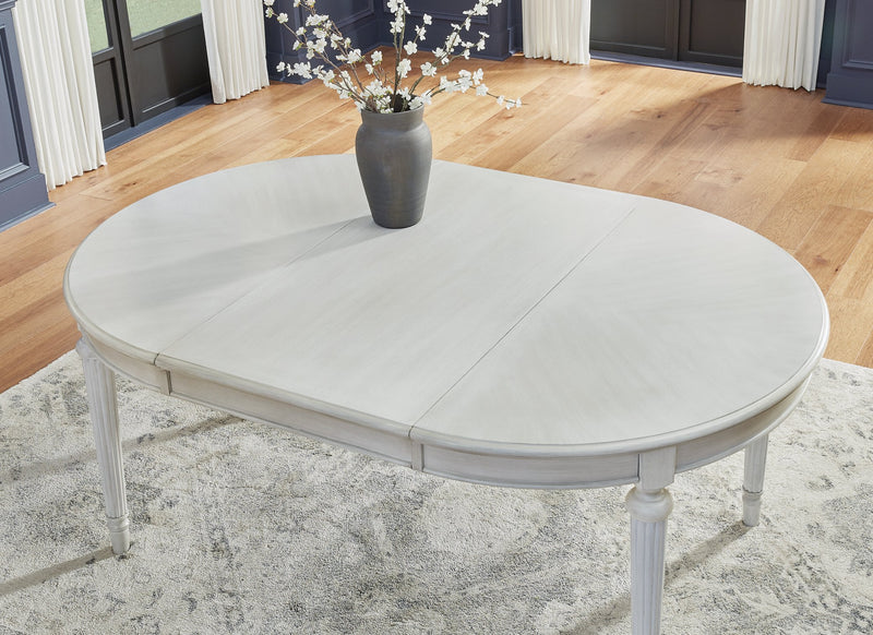 Ashley Furniture Montelaine dining room set with formal seating, featuring a wooden table and elegant upholstered chairs.