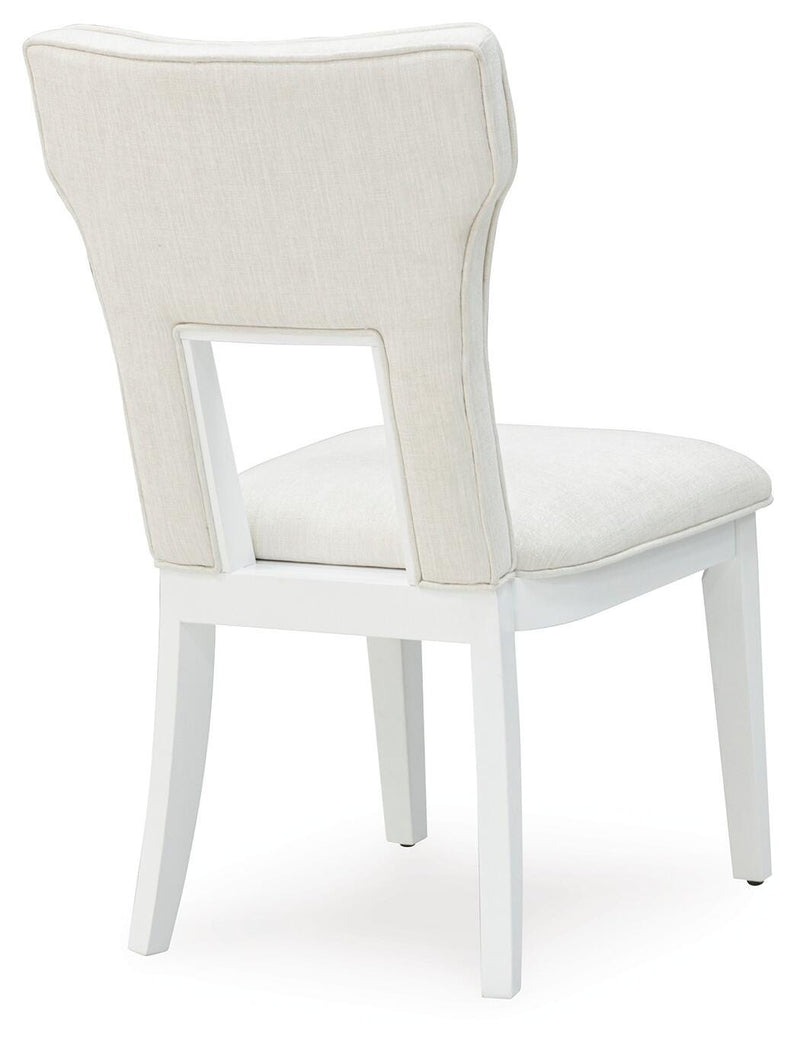 Ashley Furniture Chalanna dining chair with dark wooden legs and upholstered seat and back, shown from the back view.
