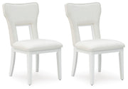 Ashley Furniture Chalanna dining chair with dark wood legs and upholstered seat, shown from an angled side view.