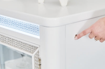 Ashley Furniture Chalanna dining server with LED lighting, featuring storage drawers and elegant wood finish.