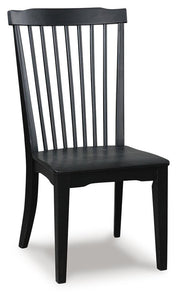 Ashley Furniture Greddinton dining room set with a rectangular table and six upholstered chairs, shown from an angled perspective.