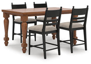 Ashley Furniture Greddinton dining room set with a wooden table and matching chairs in a modern dining space.