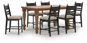 Ashley Furniture Greddinton dining room set featuring a wooden table and matching chairs in a classic design.