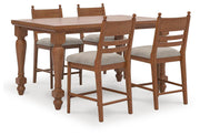 Ashley Furniture Greddinton dining room set with a table and matching chairs, featuring a warm wood finish and classic design.
