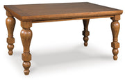 Ashley Furniture Greddinton dining room set, includes a large wooden table with six upholstered chairs, shown from an angled view.