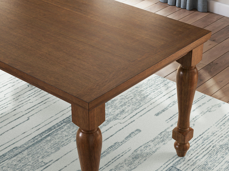Ashley Furniture Greddinton dining room set with a wooden table and six upholstered chairs in a modern dining space.