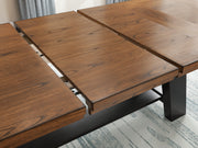 Ashley Furniture Greddinton dining room set with a wooden table, six upholstered chairs, and a decorative leaf detail.