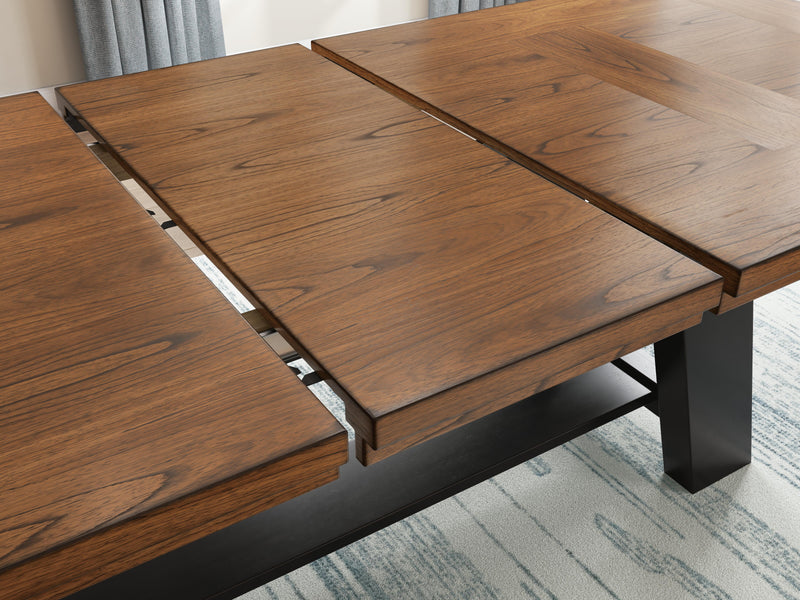 Ashley Furniture Greddinton dining room set with a wooden table, six upholstered chairs, and a decorative leaf detail.