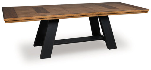 Ashley Furniture Greddinton dining extension table with a leaf, shown from an angled side view in a modern dining room setting.