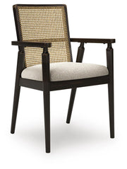 Ashley Furniture Galliden dining arm chair with wooden frame and upholstered seat, shown from an angled side view.