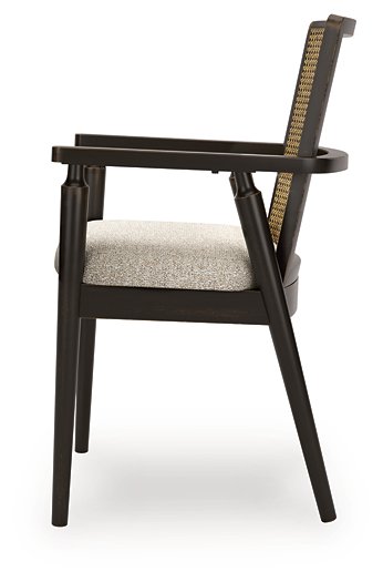 Ashley Furniture Galliden dining arm chair with upholstered seat and wooden legs, shown from the side view.