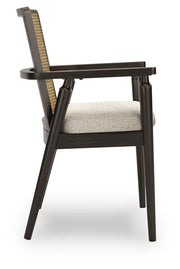 Ashley Furniture Galliden dining arm chair with wooden legs and cushioned seat, shown from the side.