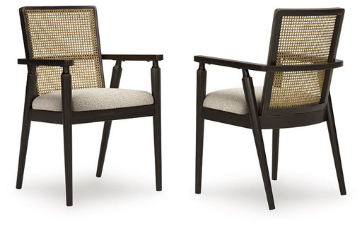 Ashley Furniture Galliden dining arm chair with cushioned seat and wooden frame, shown from a side angle.