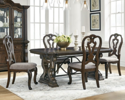Ashley Furniture Maylee dining room set with a wooden table and matching chairs, shown in a modern dining space.