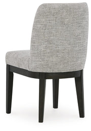 Ashley Furniture Burkhaus dining room set with a wooden table and six matching chairs, shown from the back in this image.