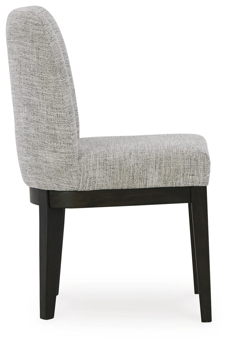 Ashley Furniture Burkhaus dining room set with a table and matching chairs, showcasing a modern wooden design.