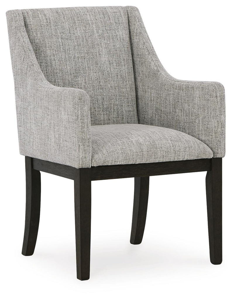 Ashley Furniture Burkhaus dining room set with a table and six upholstered chairs, shown from an angled view.