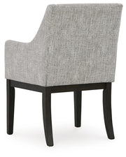 Ashley Furniture Burkhaus dining room set with table and chairs, shown from the back in a well-lit dining space.