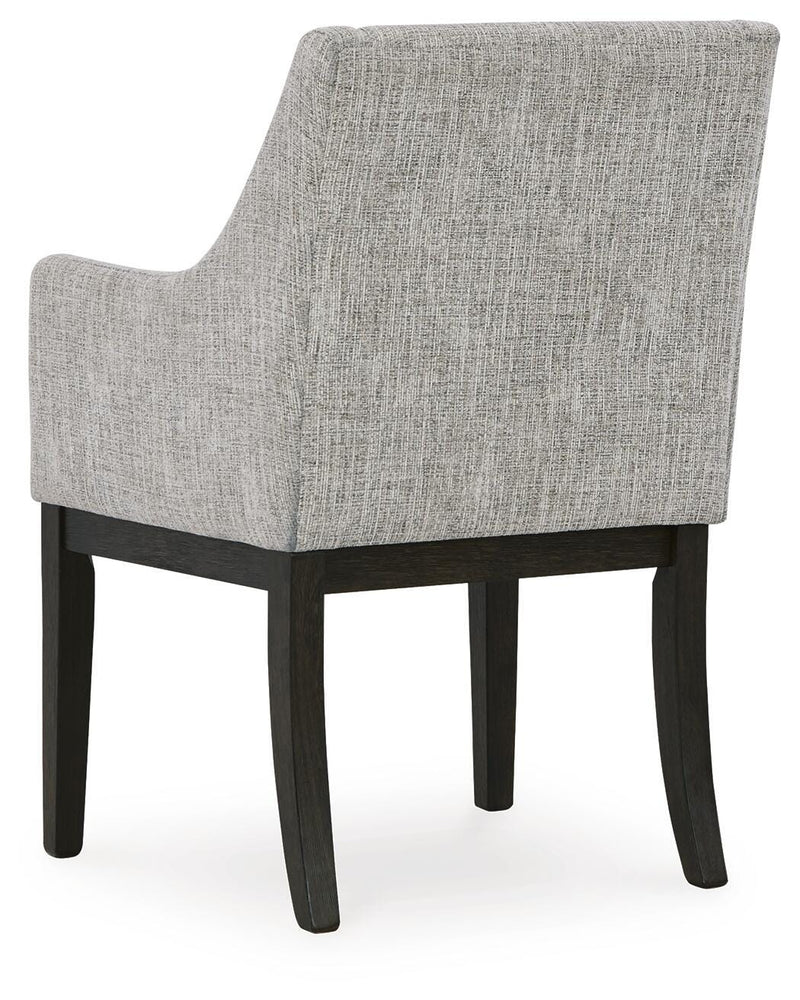 Ashley Furniture Burkhaus dining room set with table and chairs, shown from the back in a well-lit dining space.