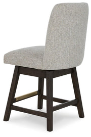 Ashley Furniture Burkhaus dining room set with a wooden table and upholstered chairs, viewed from an angle showing the back and side.