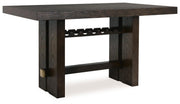 Ashley Furniture dining room set with a wooden table and matching chairs, viewed from an angled side perspective.