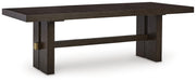 Ashley Furniture Burkhaus dining room set with a wooden table and upholstered chairs, shown from an angled side view.