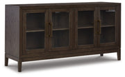 Ashley Furniture Burkhaus dining room set with a table and six chairs, shown from an angled view in a modern dining space.