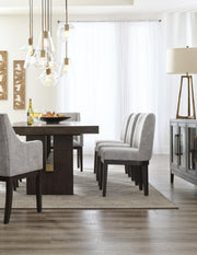 Ashley Furniture Burkhaus dining room set with a table and chairs, featuring a modern design in a cozy dining space.