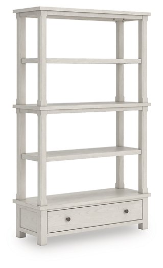 Ashley Furniture Robbinsdale 75-inch wood bookcase shown from an angle with multiple shelves and a warm wood finish.