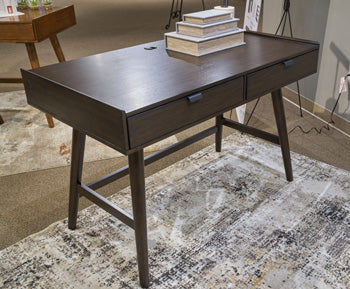 Ashley Furniture Dantenton 46-inch home office desk with a modern wooden surface and sleek metal legs.