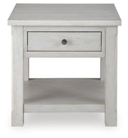 Ashley Furniture Robbinsdale End Table with a sleek wood finish and modern design, shown from a head-on angle.