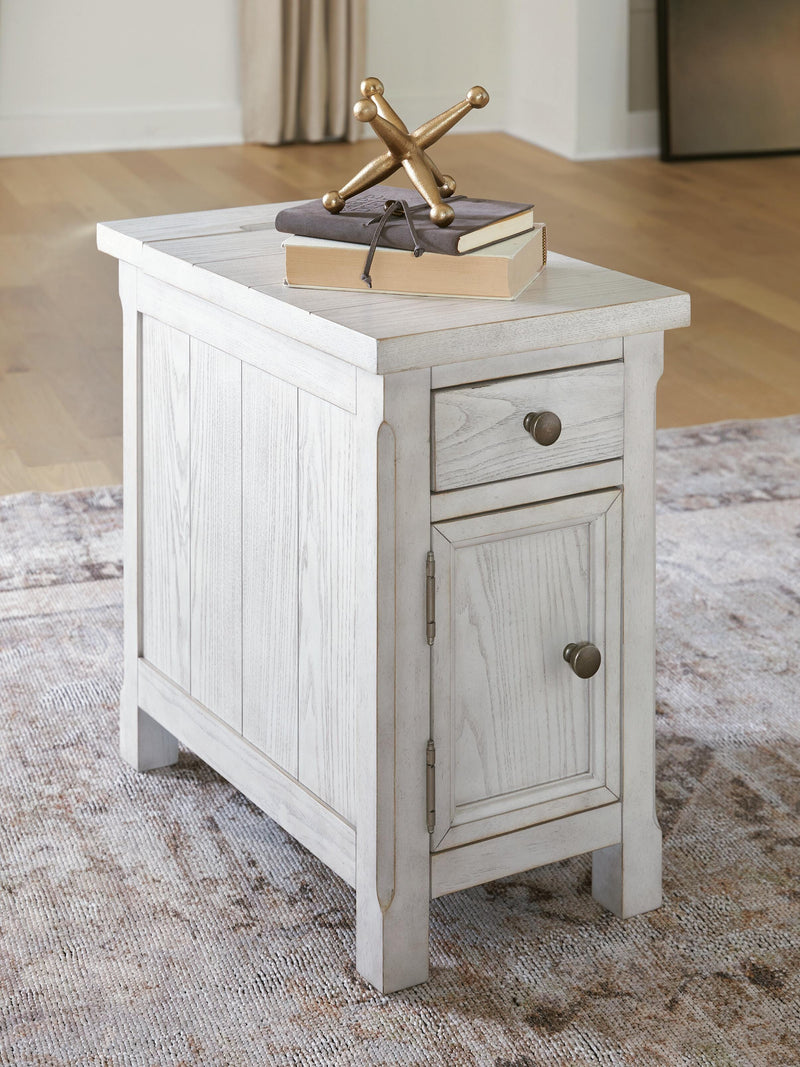 Ashley Furniture Robbinsdale chairside end table with wood finish and storage drawer, designed for small living spaces.
