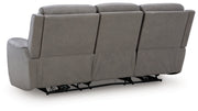 Ashley Furniture 5Z-Comfort Power Reclining Sofa with plush upholstery and reclining seats, shown from the back view.