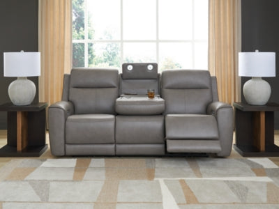 Ashley Furniture 5Z-Comfort Power Reclining Sofa showing plush fabric upholstery and reclining mechanism in a modern living room setting.