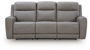Ashley Furniture 5Z-Comfort Power Reclining Sofa showing plush gray fabric, padded armrests, and built-in reclining mechanisms.