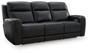 Ashley Furniture 5Z-Comfort Power Reclining Sofa with plush cushions and reclining features, shown from an angled view.