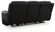 Ashley Furniture 5Z-Comfort power reclining sofa showing plush back cushions and reclining mechanism in a modern living room setting.