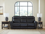 Ashley Furniture 5Z-Comfort Power Reclining Sofa in plush fabric with padded arms and built-in recline mechanism.