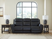 Ashley Furniture 5Z-Comfort Power Reclining Sofa shown open with plush cushions and reclining mechanism in a modern living room setting.