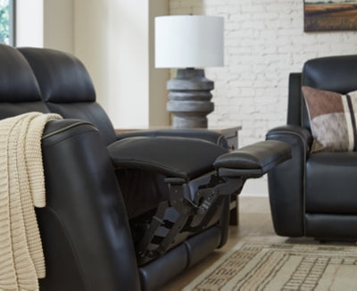 Ashley Furniture 5Z-Comfort power reclining sofa with plush cushions and extended footrest, showcasing its sleek, modern design.
