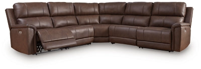 Ashley Furniture Bleckley power reclining sectional with plush cushions and reclining seats in a modern living room setting.