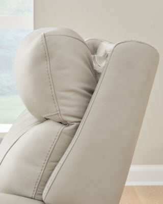 Ashley Furniture Pincara Power AutoGlide Recliner in dark upholstery, featuring a plush cushioned seat and adjustable reclining mechanism.