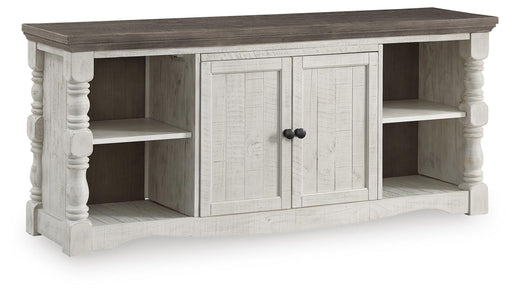 Ashley Furniture Havalance 67-inch TV stand with open shelving and storage compartments, shown from an angled view.
