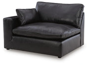 Ashley Furniture Emilia sectional sofa in a neutral fabric with plush cushions and chaise lounge